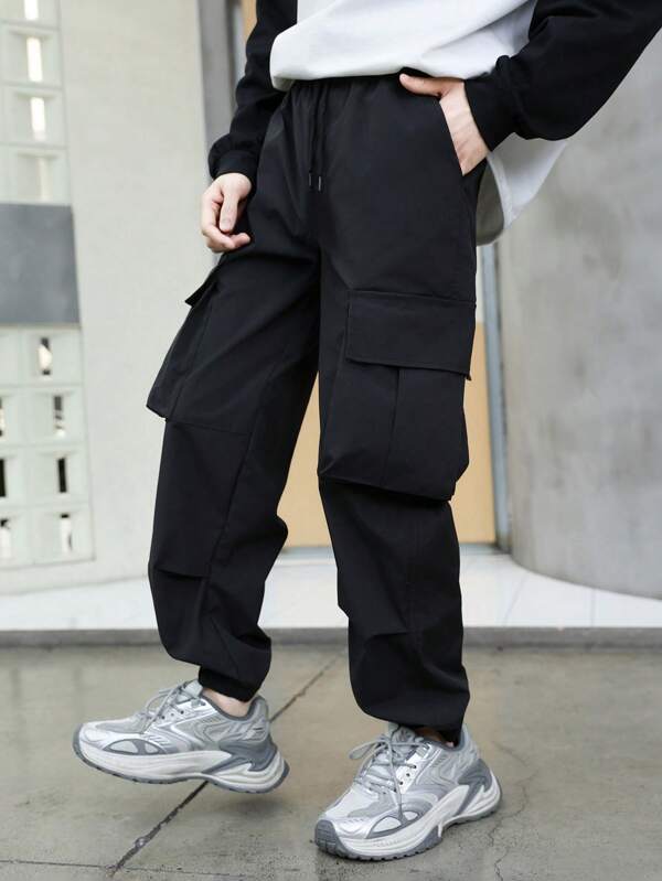1 Stück Teens/Jugend Jogginghose mit Tunnelzug Taille, großen Taschen und Fesselbündchen, schwarze Outdoor Sporthose