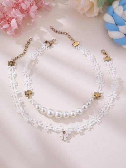 Set de 2 collares de niña con flor de satén, perla y mariposa