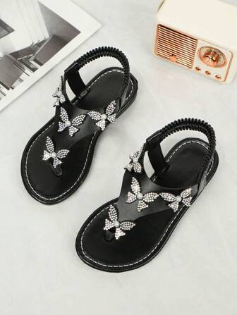 儿童凉鞋2025夏季新款时尚一体式圆头平底露趾简约大气钻面蝴蝶弹力一脚蹬防滑沙滩凉鞋居家户外