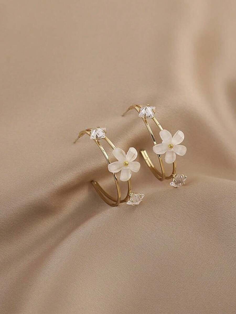 1 par de aretes elegantes y lujosos de metal y resina con diseño floral para mujeres