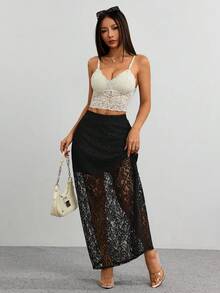 Saia vintage preta de cintura alta com corte reto e painel de malha