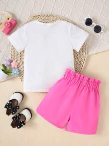 Set de 2 piezas para niñas que incluye camiseta de manga corta con cuello redondo y estampado de dibujos animados en la espalda, y shorts casuales de unicolor cómodos, ideal para verano