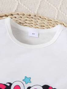 Set de 2 piezas para niñas que incluye camiseta de manga corta con cuello redondo y estampado de dibujos animados en la espalda, y shorts casuales de unicolor cómodos, ideal para verano