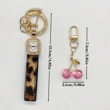 TTOBS 1pc Handmade Leopard Leather Car Key Chain With Unique Cherry Pendant - , Fashionable And Multifunctional Backpack Key Chain, Perfect Accessory For Backpacks. An Ideal Gift For St. Patrick's Day, Valentine's Day, Or For Your Beloved Lady. - Multicolor - View 6