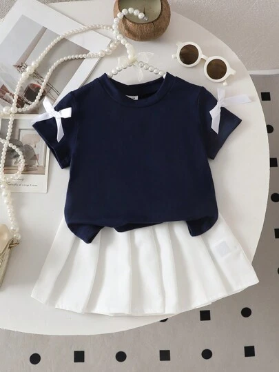 2 件套女婴蝴蝶结装饰休闲 T 恤和百褶裙套装，可爱甜美街头装，适合户外玩耍