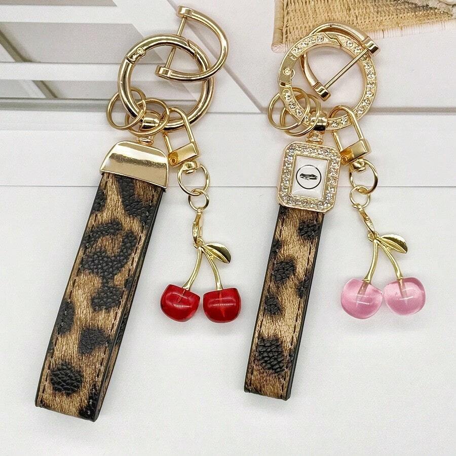 TTOBS 1pc Handmade Leopard Leather Car Key Chain With Unique Cherry Pendant - , Fashionable And Multifunctional Backpack Key Chain, Perfect Accessory For Backpacks. An Ideal Gift For St. Patrick's Day, Valentine's Day, Or For Your Beloved Lady. - Multicolor - View 1