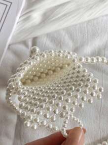 女孩仿珍珠串珠斜挎包