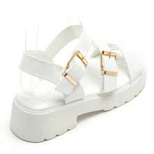 Sandali grossi à double sposa con boucle dorée et semelle crantée