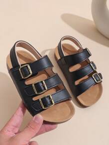 1 Paar schwarze Sandalen für Kleinkind/Babys in großer Größe, Komfortabler römischer Stil, PU-Riemen mit verstellbarem Metallschnallenverschluss, runde Zehenkappe, rutschfeste Gummisohle, modisch niedliche flache Sandalen für Jungen und Mädchen von 3-12 Jahren, für Alltag, Outdoor, Urlaub, Frühling/Sommer