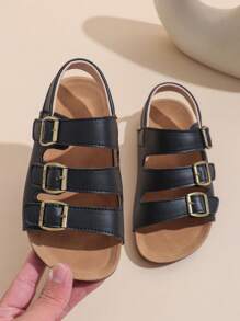 1 Paar schwarze Sandalen für Kleinkind/Babys in großer Größe, Komfortabler römischer Stil, PU-Riemen mit verstellbarem Metallschnallenverschluss, runde Zehenkappe, rutschfeste Gummisohle, modisch niedliche flache Sandalen für Jungen und Mädchen von 3-12 Jahren, für Alltag, Outdoor, Urlaub, Frühling/Sommer