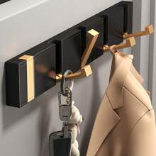 带孔隐形挂钩，可挂在卫生间的墙上。进门后也可当衣架使用，适合摆放在玄关，也可作为卧室里的折叠衣帽钩使用。