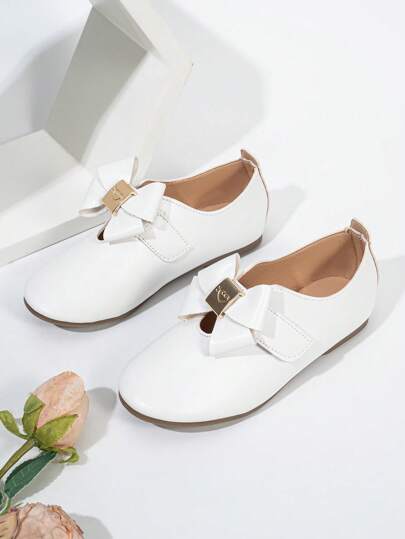 Zapatos planos de moda cómodos, transpirables y antideslizantes para niñas con diseño de ola y decoración de lazo dorado