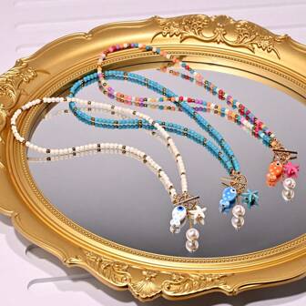 海洋风格迷人吊坠项链，配有 4 毫米人造绿松石链、陶瓷鱼和人造珍珠海星饰品