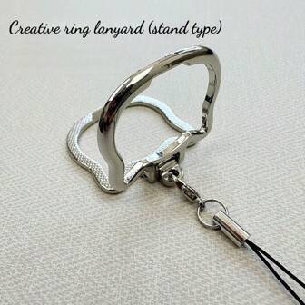 Cordón multifuncional para teléfono móvil 2 en 1 - Soporte universal plegable de metal en forma de aro pendiente para celular o tableta, regalo para madre, familia, amigos, cumpleaños, festivo