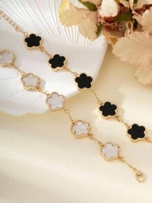 Set de 2 pulseras con diseño clásico de trébol en blanco y negro de moda