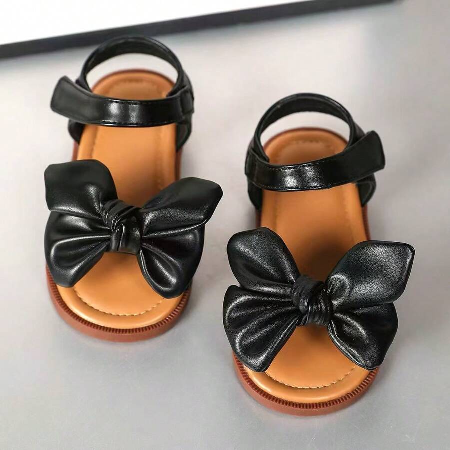 Sandalias con hebilla cerrada decoradas con moño clásico, suela blanda, zapatos tipo princesa para caminar para niños pequeños, versátiles para primavera, verano, otoño e invierno - Negro - Ver 1