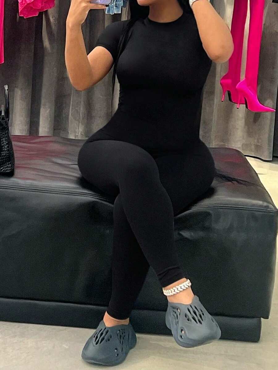 LovelyWholesale Women'S Casual Round Neck Short Sleeved Solid Color Back Zipper Jumpsuit Spring And Summer - Black - View 1