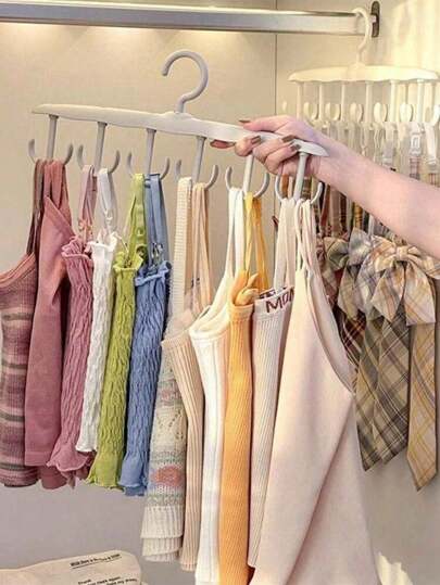 1个多功能旋转衣架，带多个挂钩，可挂领带和围巾，节省空间，是衣柜收纳的理想之选。这款旋转衣架适用于卧室或宿舍，轻巧耐用，方便取用，可整齐展示围巾和领带，收纳腰带和小饰品，用途广泛，可用于衣柜、抽屉和玄关收纳，是家居收纳和时尚配饰的理想礼物。