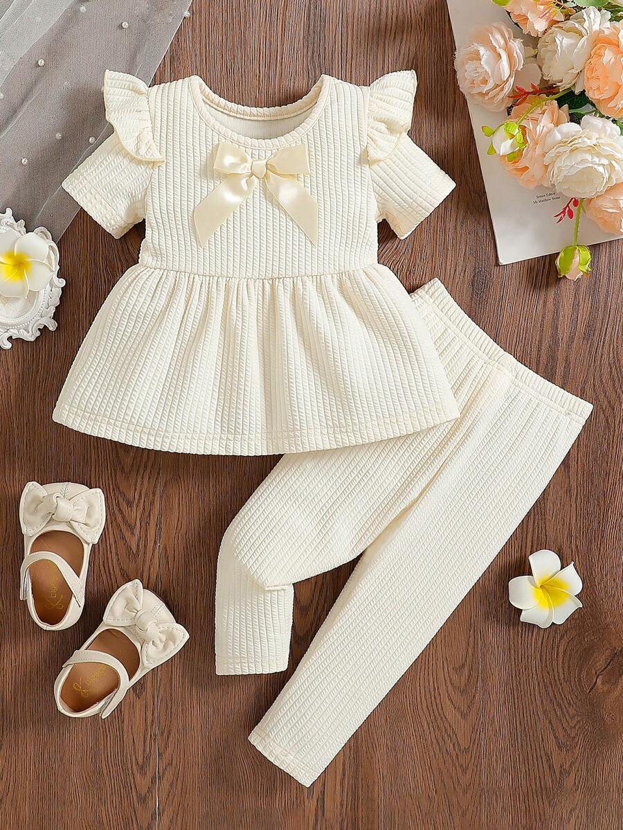 2pcs Baby Girls' Minimalist Solid Color Round Neck 3D Bow Ruffle Hem Short Sleeve T-Shirt And Elastic Waist Solid Color Knit Pants Set, Suitable For Home, Daily Wear And Outings, Spring/Autumn - Beige - View 1