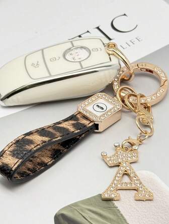 TTOBS 1pc Elegant Leopard Print Leather Cord Car Key Chain, With Shiny Alloy 26 Letter Rhinestone Pendant - Durable, Fashionable And Multifunctional Women's Keychain - Multiple Colors, Perfect Accessory And Stylish Gift Idea For Car Owners