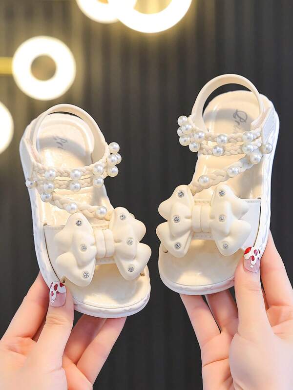 1 par de sandalias con lazo de perlas para niños, sandalias de verano para la playa con color rosa para niñas