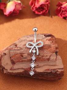 A Bow Shaped Micro Inlaid Copper Navel Nail