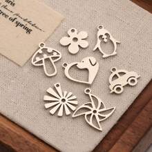 Juego de 7 colgantes de flor, seta y pingüino pulidos y huecos de acero inoxidable dorado para hacer collares, pulseras y llaveros de joyería DIY