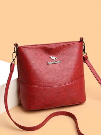 1 件纯色 PU 皮革大容量轻便斜挎包，带金属袋鼠装饰，适合女性日常使用