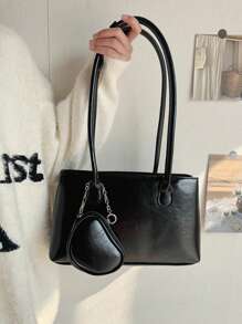 Czerwony wisiorek w kształcie serca, kwadratowa torba z wzorem bagietki, torba typu tote z połyskującą fakturą, woskowana olejem, torba na ramię.