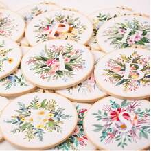 1pc 26 Designs Floral Embroidery Kit With English Letters, Luxury Starter Set For Beginners, Includes Fabric, Hoop, Threads, Needles, Instructions, Great For Cross Stitch, Artistic Craft Gift For Friends And Family, Wedding Decor. Each Kit Contains 1pc Printed , 1 Set Of Embroidery Threads, 1 Bamboo Embroidery Hoop, 1 Pattern Chart, 2pcs Embroidery Needles.