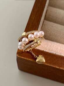 1 pièce pendentif à clip d'oreille en forme de cœur creux à plusieurs couches de perles, en matériau de cuivre de couleur dorée, léger et élégant, convient pour un port quotidien pour les femmes