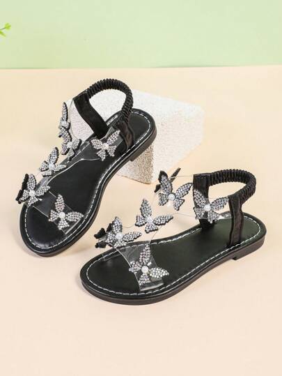 1 Pair Black Plus Size Toddler Girls' Flat Sandals, Transparent Material With Glitter, Floral Decor, Elastic Back Strap, Round Toe, Non-Slip, Fashion & Cute Roman Style Sandals, Suitable For 3-15 Years Old Girls, Casual, Party, Holiday, Spring/Summer