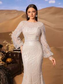 Faeriesty 高级魅力优雅长袖亮片鱼尾礼服，专为女性打造——精致的水晶串珠刺绣，闪耀夺目的全身细节，修身喇叭裙摆，适合红毯活动、奢华婚礼、正式晚宴和时装秀等场合。