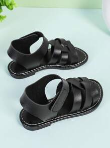 1 paire de sandales plates à bout fermé en PU tissé noir pour filles, à la mode et mignonnes, adaptées aux garçons et aux filles de 3 à 15 ans, tenue décontractée au quotidien, nouvelle collection printemps/été 2025