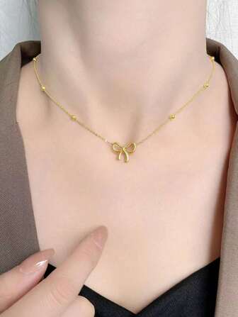 1 时尚金色不锈钢链蝴蝶结吊坠项链，适合日常佩戴，是送给女性的节日礼物