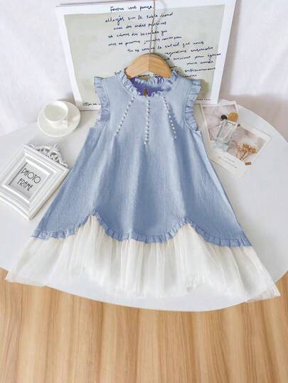 这款女童田园风象牙色网纱荷叶边连衣裙，设计清新优雅，是女孩参加派对、表演和拍照的必备单品，适合4-7岁女孩，春夏穿着。网纱易燃，请远离火源。