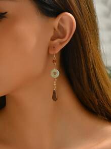 1 par de pendientes redondos huecos de estilo retro chino a la moda para mujeres, adecuados para uso en exteriores