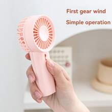 1 pieza Mini ventilador de mano para volver a la escuela con 2 pilas AA (pilas no incluidas)