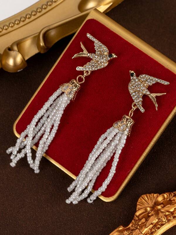 1 para eleganckich kolczyków w kształcie latającego ptaka z kryształkami i frędzlami w kształcie kwiatów w stylu vintage, modne efektowne długie kolczyki