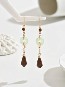 1 par de pendientes redondos huecos de estilo retro chino a la moda para mujeres, adecuados para uso en exteriores