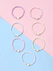 Set de 7 pulseras decorativas para niñas con dijes de corazón, estrella y mariposa de cuentas de colores, para uso diario