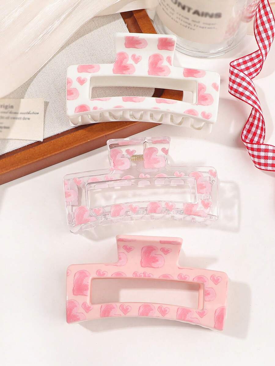 Set de 3 pinzas para el cabello con estampado de corazón rosa, pinzas cuadradas simples y pinzas de estilo callejero lindo como accesorio de cabello para el Día de San Valentín. Pinzas, pasadores, mordazas y recogedor de cabello como accesorios de cabello para mujer para vacaciones y atuendos de verano. - Multicolor - Ver 1
