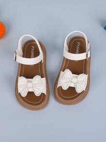 1 双纯色女童平底凉鞋，带蝴蝶结和钩环设计，适合夏季