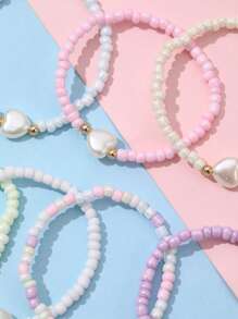Set de 7 pulseras decorativas para niñas con dijes de corazón, estrella y mariposa de cuentas de colores, para uso diario