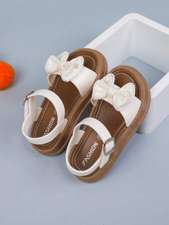 1 双纯色女童平底凉鞋，带蝴蝶结和钩环设计，适合夏季