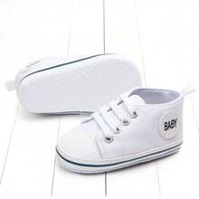 Zapatos blancos para bebé, diseño simple de cordones para niños y niñas, moda suave, suela antideslizante, zapatos planos para recién nacidos