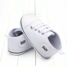 Zapatos blancos para bebé, diseño simple de cordones para niños y niñas, moda suave, suela antideslizante, zapatos planos para recién nacidos