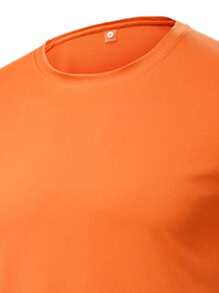 男士冰丝速干套装，橙黑拼色流畅剪裁。健身、跑步、训练服装，夏季吸汗