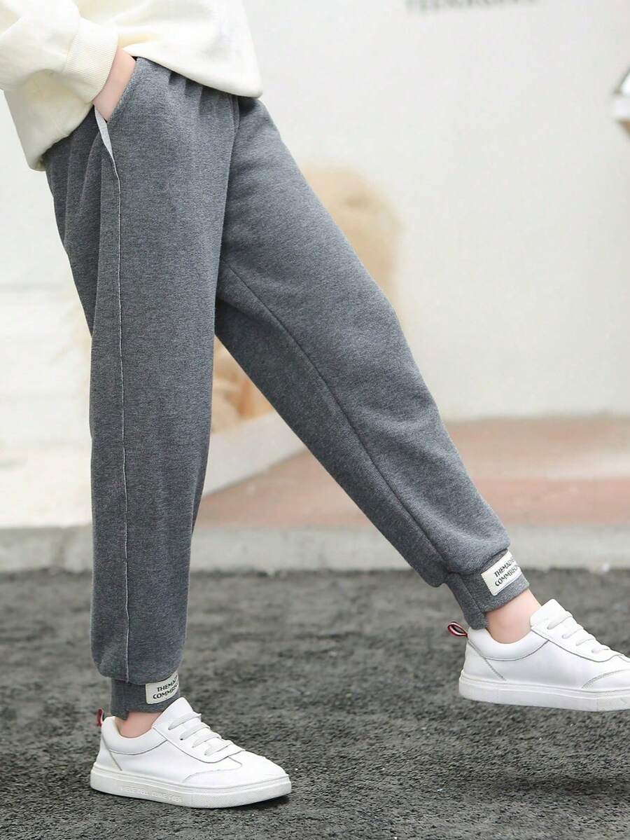 Pantalones deportivos holgados de color liso versátiles, pantalones casuales sueltos para niñas y niños bebés, pantalones de estilo coreano, pantalones de niña joven