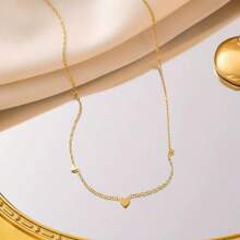Conjunto de joyería de collar y pulsera con forma de corazón romántica, de acero de titanio en tono dorado, diseño único para mujer